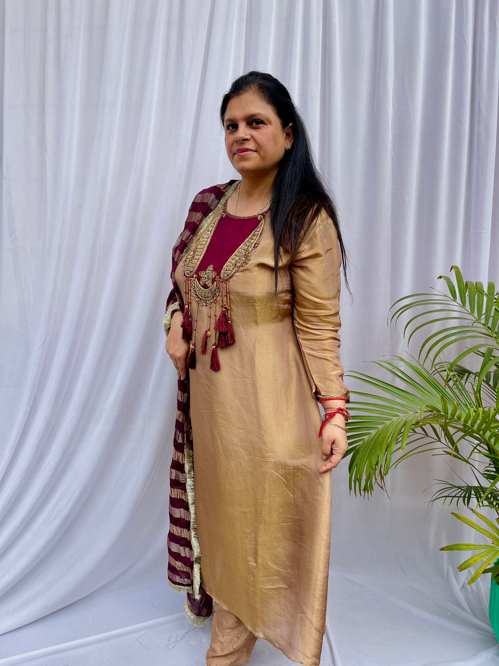Gold and maroon embroidered luxe suit set with tassel neckline and dupatta wedding wear for women