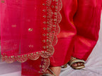 Close up of hot pink farsi embroidery and dupatta border detailing with intricate threadwork