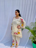 Elegant ivory white chanderi silk tunic co-ord set with large colorful floral embroidery, tassel fringe, and matching embroidered pants.
