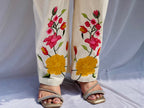 Elegant ivory white chanderi silk tunic co-ord set with large colorful floral embroidery, tassel fringe, and matching embroidered pants.