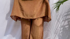 Antique gold crinkled silk ensemble with a heavily embellished sequin neckline and wide-leg flared palazzos.