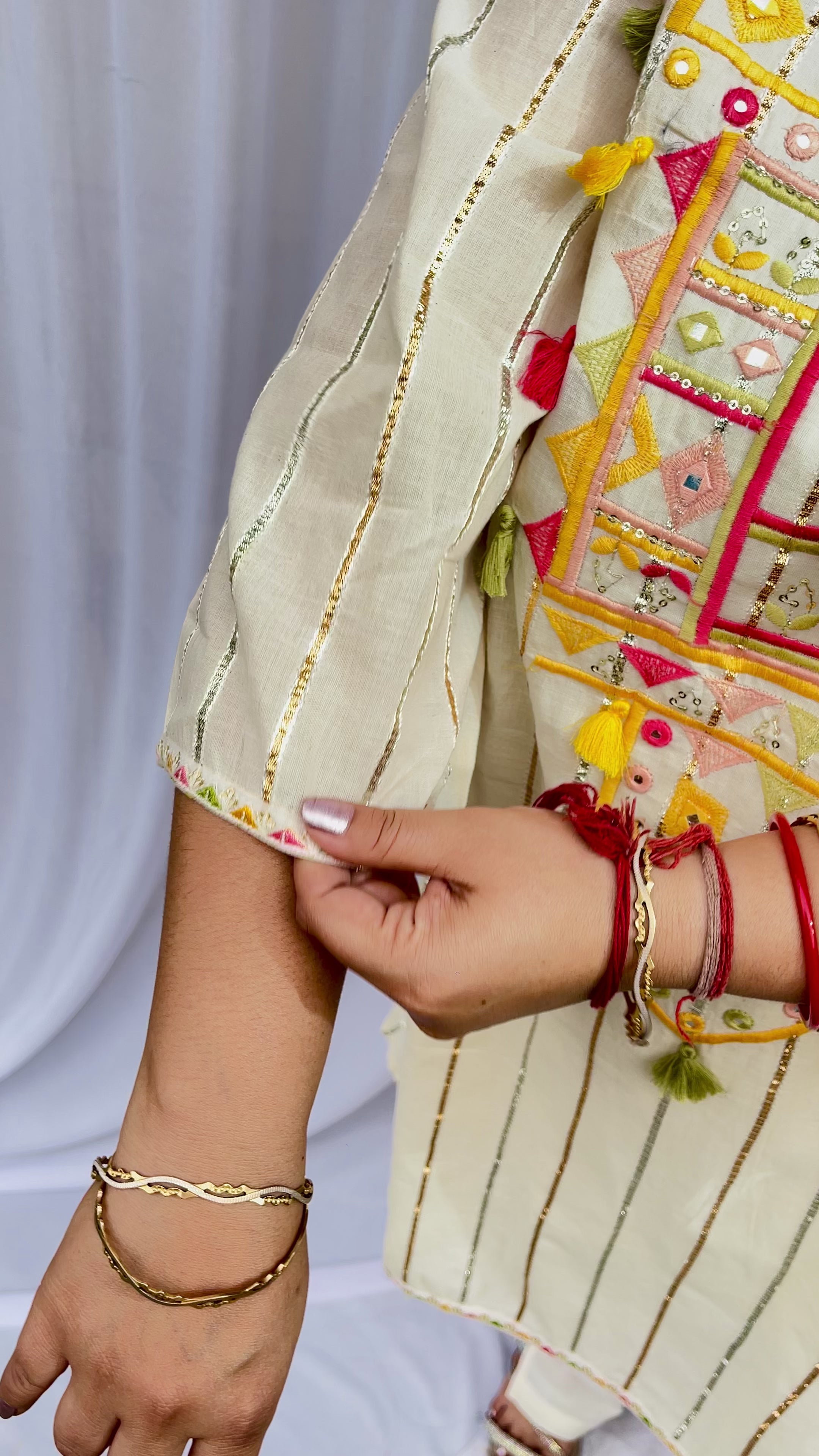 Ivory Embroidered Kurta Set with Tassel Details